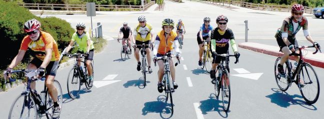 A group of Santa Cruz County Cycling Club volunteers previewed the new 35-mile course of the Santa Cruz Mountains Challenge on July 19. The event, with four routes, happens July 26. From left, Bart Coddington, Kathy Ferraro, Jeff Brody, David Hemrick, Allison Garcia, Jim Wheeler, Judy Isvan, Teri Ruegg and Richard Huffman. (Grace Voss — Contributed)